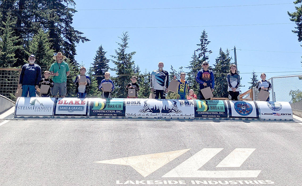 These Lincoln Park BMX racers raised $5,500 for the Race for Life fundraisers. From left are George Williams, Bradan Gray, track operator Sean Coleman, Zebastian Ferrier-Dixon, Kristopher Giffin, Bennett Gray, Wayne Goldsbary, Orion Hedin, Andy Goldsbary, Cash Coleman and Kylin Weitz. (Courtesy photo)