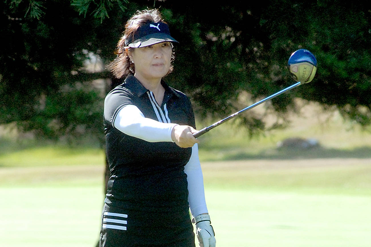 Keith Thorpe/Peninsula Daily News
Yoon Park of Sequim takes aim on the first hole at Peninsula Golf Course at the start of Saturday's Clallam County Amateur tournament.