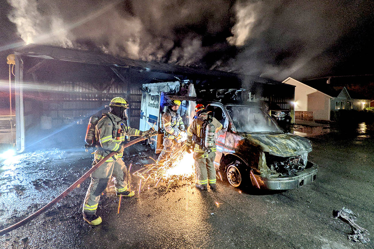 Firefighters respond to an early morning fire at Olympic Ambulance early Tuesday. (Clallam County Fire District 3)