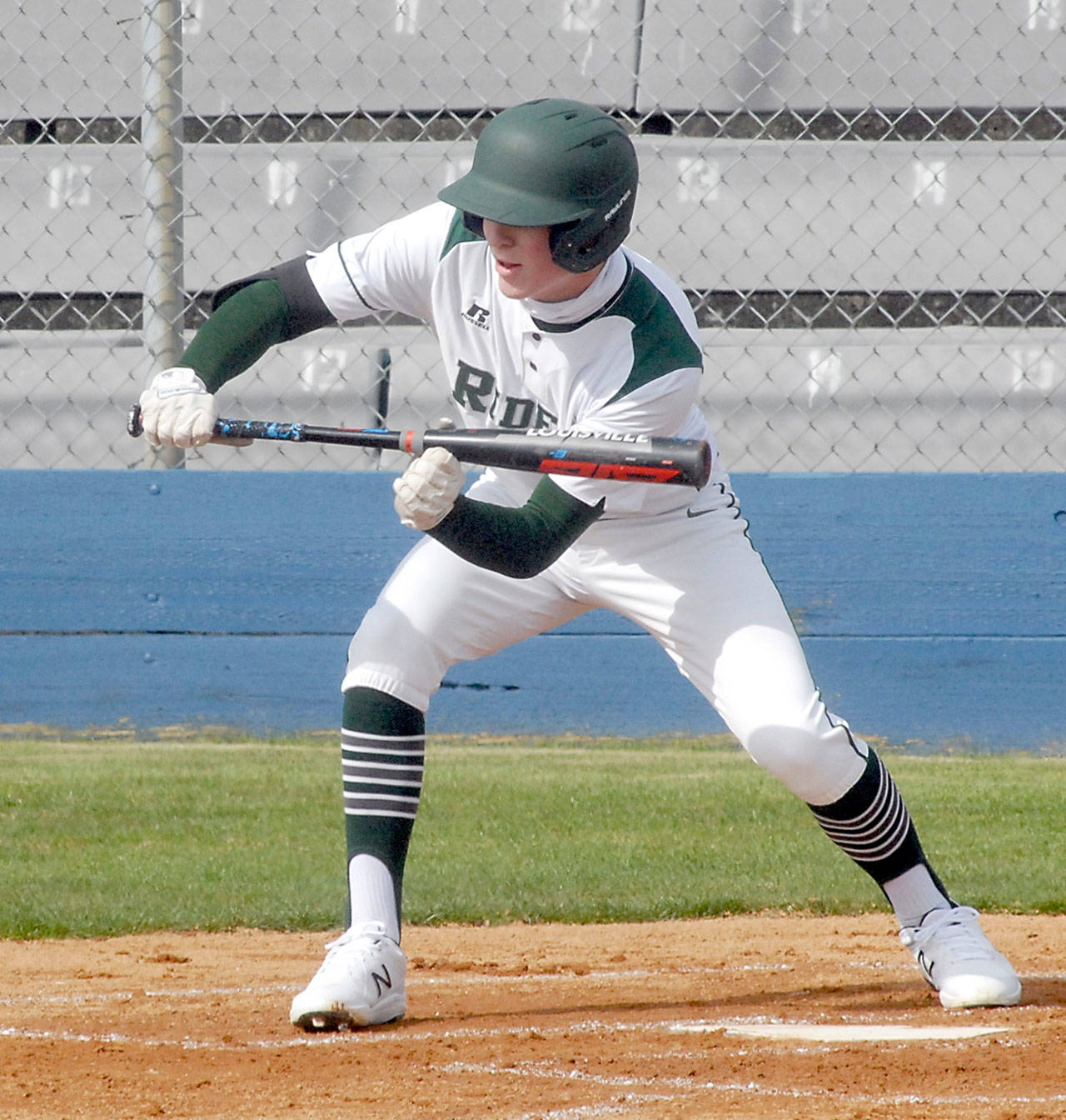 Port Angeles’ Wyatt Hall attempts to bunt in his opening at-bat against North Mason in March at Port Angeles Civic Field. Hall has signed a letter of intent to play baseball at Skagit Valley College in Mount Vernon. (Keith Thorpe/Peninsula Daily News)