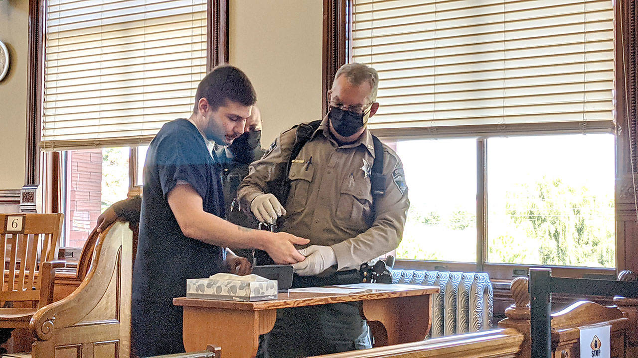 Robert John Cuevas, left, was sentenced to four years in prison on Friday after kidnapping and assaulting another Port Townsend resident last fall. (Zach Jablonski/Peninsula Daily News)