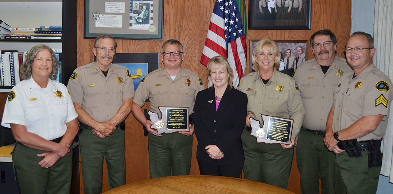 The Clallam County Sheriff’s Office’s command staff with accreditation plaques from the Washington Association of Sheriffs and Police Chiefs. Pictured, from left, are Chief Civil Deputy Alice Hoffman, Sheriff Bill Benedict, Chief Criminal Deputy Brian King, Administrative Manager Lorraine Shore, Chief Corrections Deputy Wendy Peterson, Undersheriff Ron Cameron and Corrections Sergeant Don Wenzl.