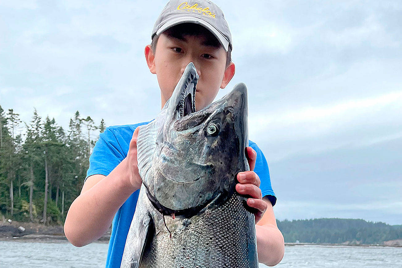 Courtesy photo
13-year-old Joey Kang of Port Angeles caught a 28-pound king salmon this week at Freshwater Bay near Eagle's Nest. Kang was fishing with his father James Kang of Port Angeles and reeled in his the giant fish himself.