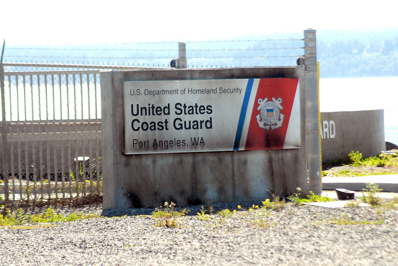 A sign at the entrance to Air Station/Sector Field Office Port Angeles on Ediz Hook is shown Wednesday after it had been set afire. (Keith Thorpe/Peninsula Daily News)