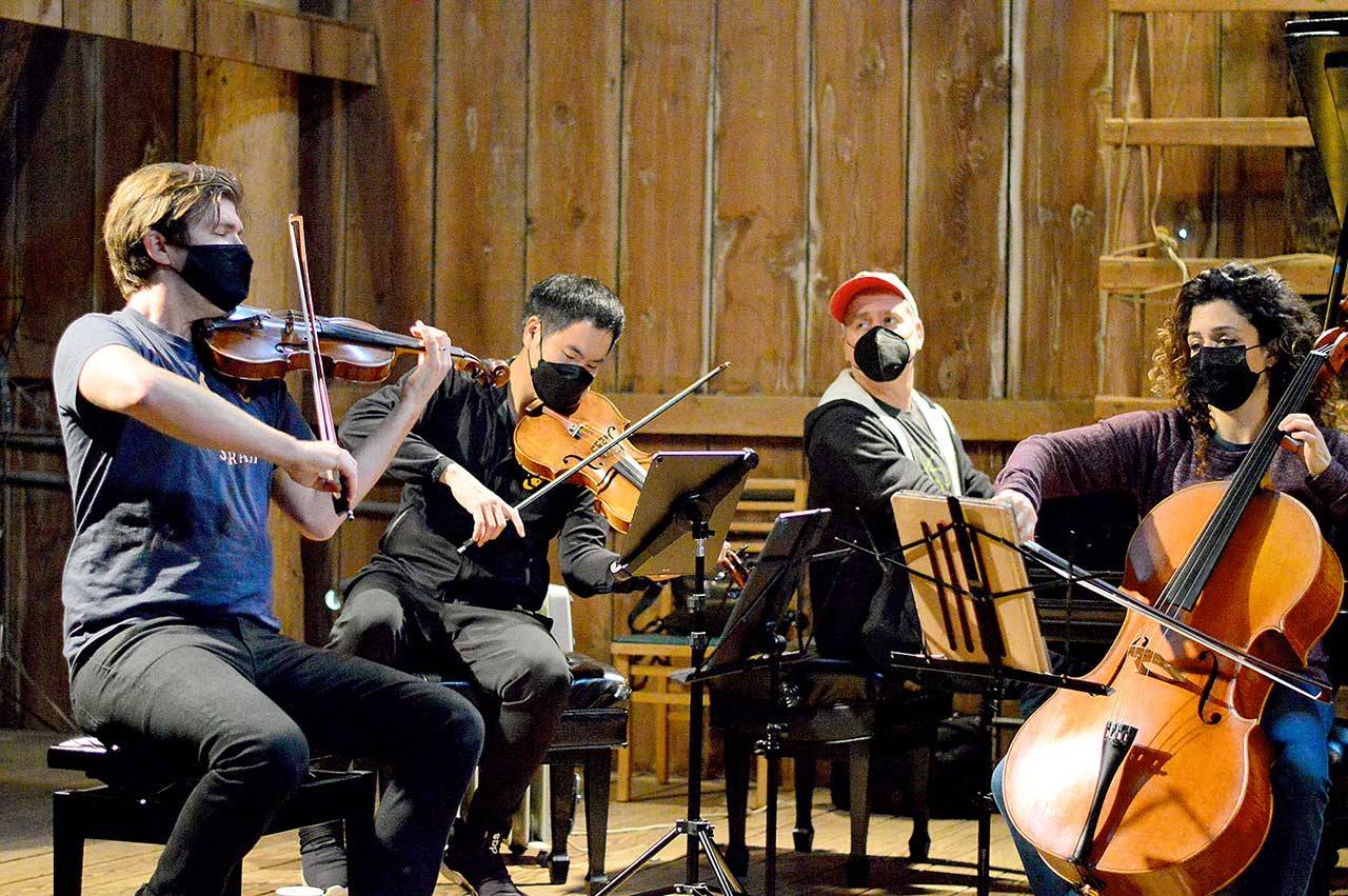 The barn at Trillium Woods Farm near Quilcene is the setting for free chamber concerts this summer, including last Sunday’s performance by, from left, James Garlick, Richard O’Neill, Jeremy Denk and Ani Aznavoorian. This weekend will bring the final Concerts in the Barn at 2 p.m. Saturday and Sunday. Patrons who sit inside the barn must show proof of vaccination. (Diane Urbani de la Paz/Peninsula Daily News)