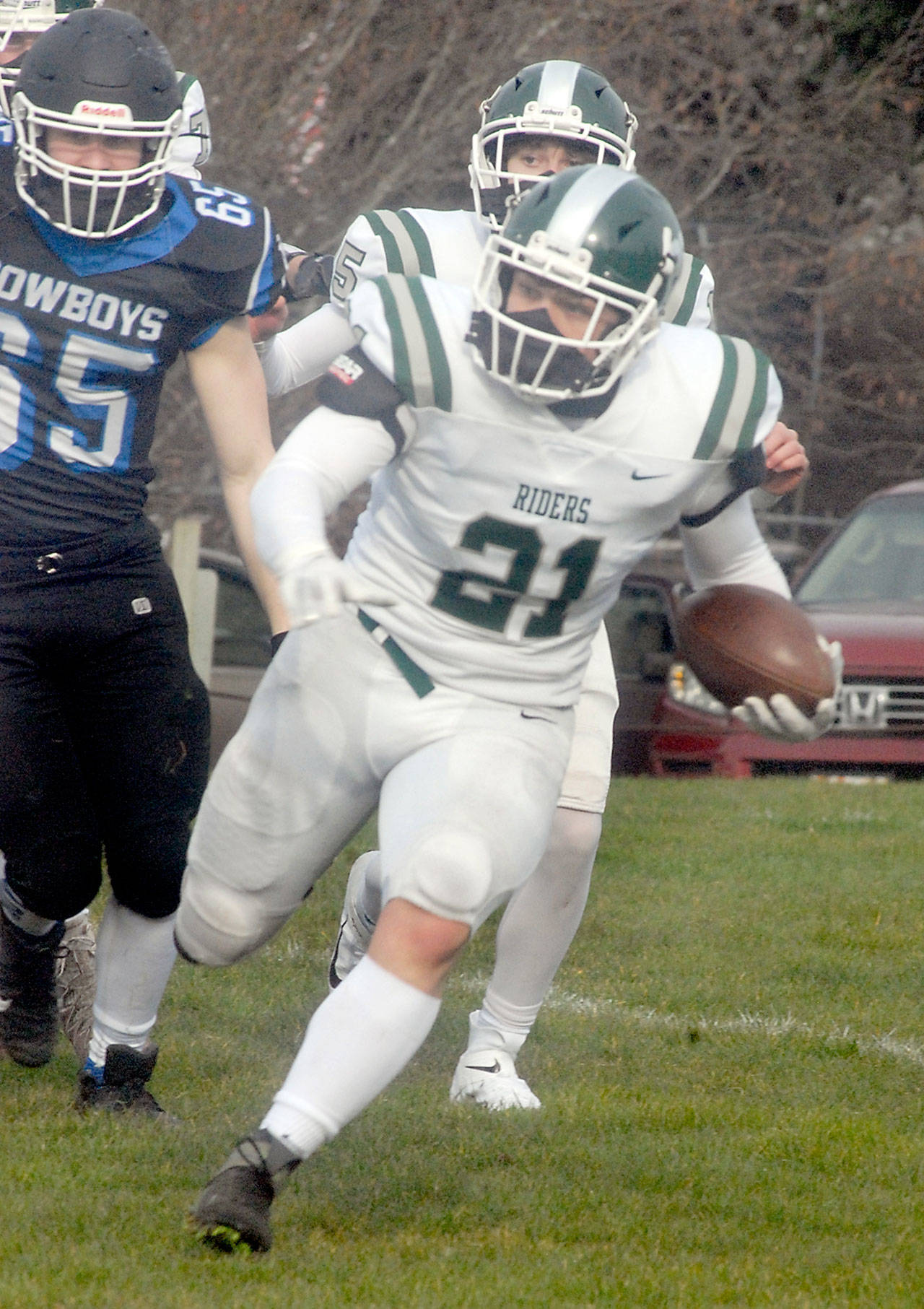 Port Angeles’ Daniel Cable runs outside during a February 2021 contest against East Jefferson. Cable, a senior, is expected to see plenty of carries for the Roughriders this fall. (Keith Thorpe/Peninsula Daily News)