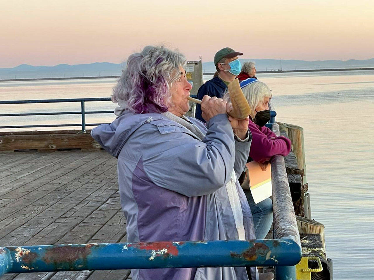 Jody Moss of Congregation Olympic B’nai Shalom blows the Shofar to usher in the Jewish New Year at sunrise Tuesday on City Pier in Port Angeles. (Paul Gottlieb/Peninsula Daily News)