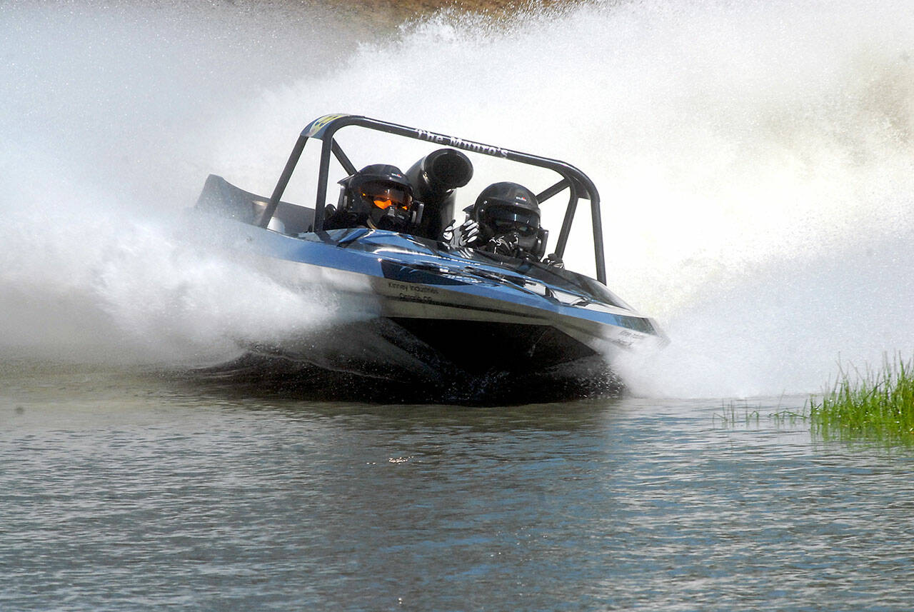 Team Kiwi, driven by Chris Munro and navigated by Katie Munro, competes at the Extreme Sports Park in Port Angeles. The team won the Unlimited Class at July’s first sprint boat race of the summer. (Keith Thorpe/Peninsula Daily News)