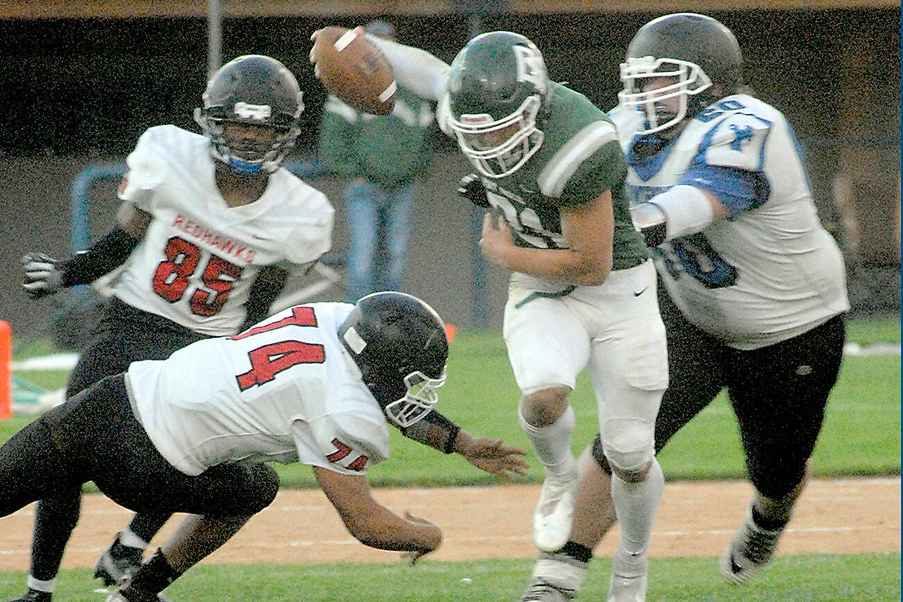 Keith Thorpe/Peninsula Daily News
Port Angeles' Daniel Cable, center, weaves around East Jefferson defenders, from left, Malachi Azariah McDonald, Gerald Lindsey and Christopher Fair on Friday in Port Angeles.