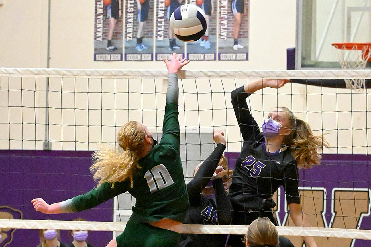 Michael Dashiell/Olympic Peninsula News Group
Sequim's Jolene Vaara, right, and Port Angeles' Kennedy Bruch battle at the net during the Wolves' 3-1 win over the Roughriders on Thursday.