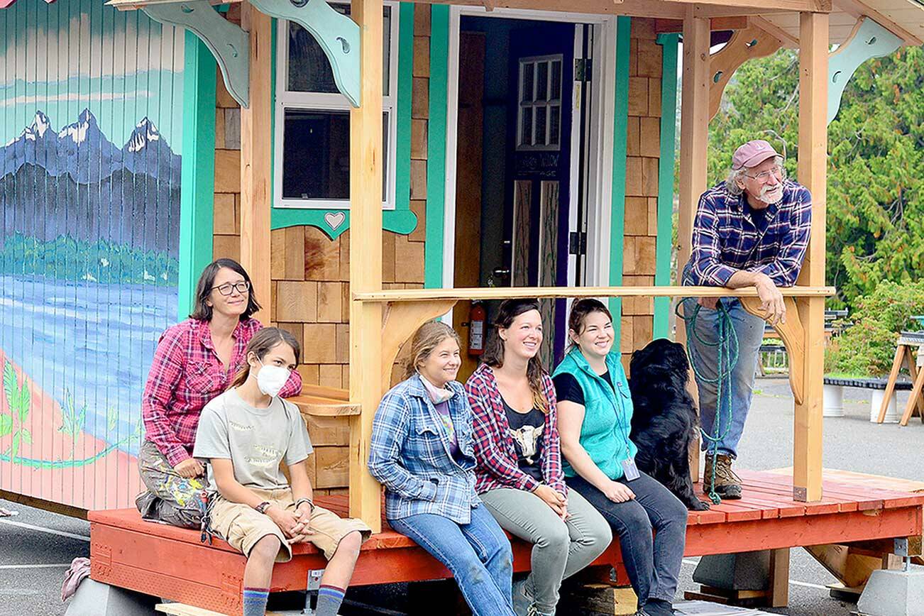 The crew behind the newest Bayside Housing-Community Boat Project tiny home includes, from left, Danielle Fodor, Raul Sierra, Lena Morton, Gillian Kenagy, Shanell Rosenfeld and Capt. Wayne Chimenti. (Diane Urbani de la Paz/Peninsula Daily News)