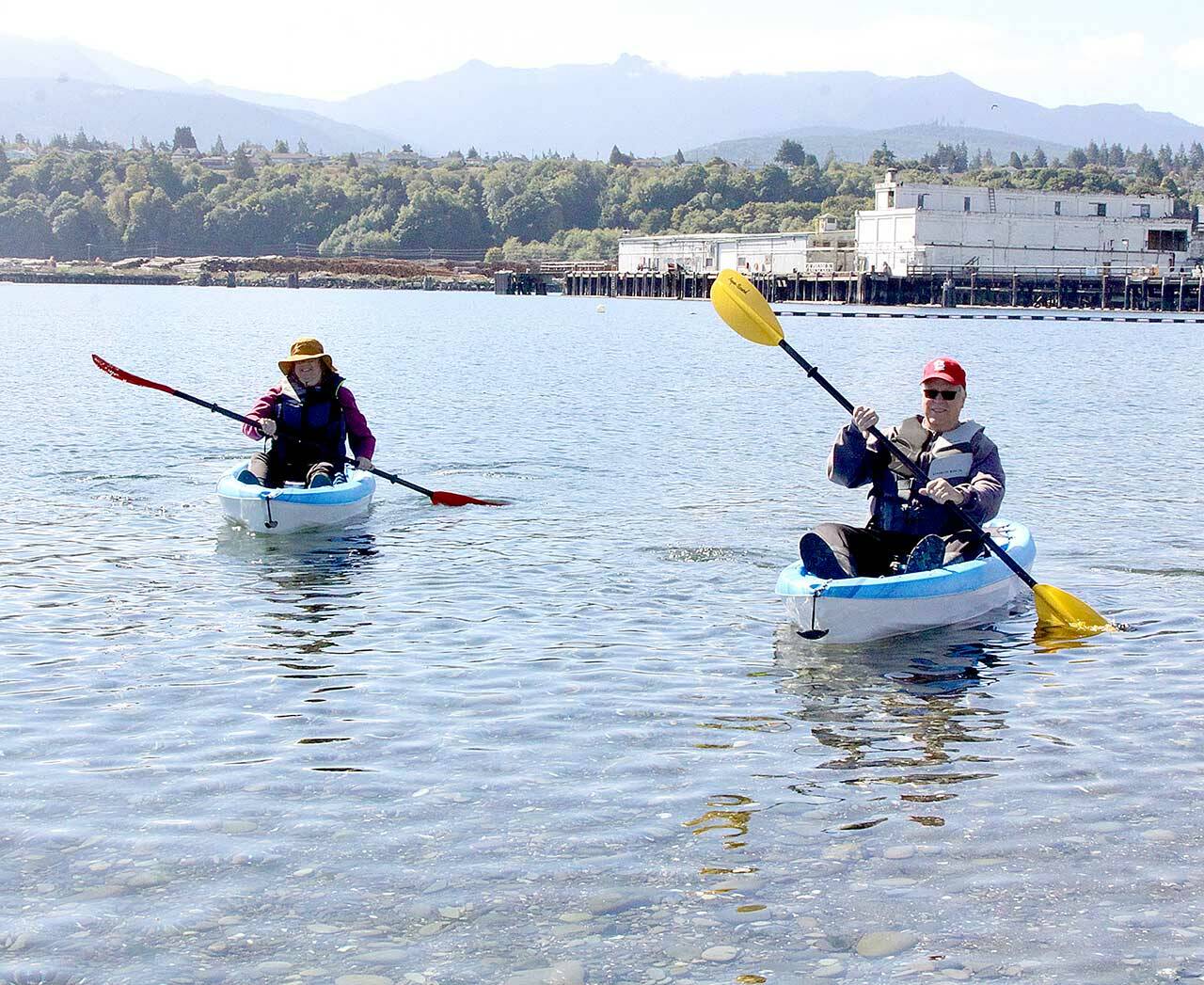 Dave Logan/For Peninsula Daily News 
Sue and Tom Lotz of Port Angeles take what they call a “coffee break” in their small kayaks near Sail and Paddle Park on Ediz Hook on Thursday. They were enjoying the last days of nice weather before a predicted rain storm expected this weekend. The Lotzes said they were greeted by at least a dozen seals in the harbor on their leisurely excursion.