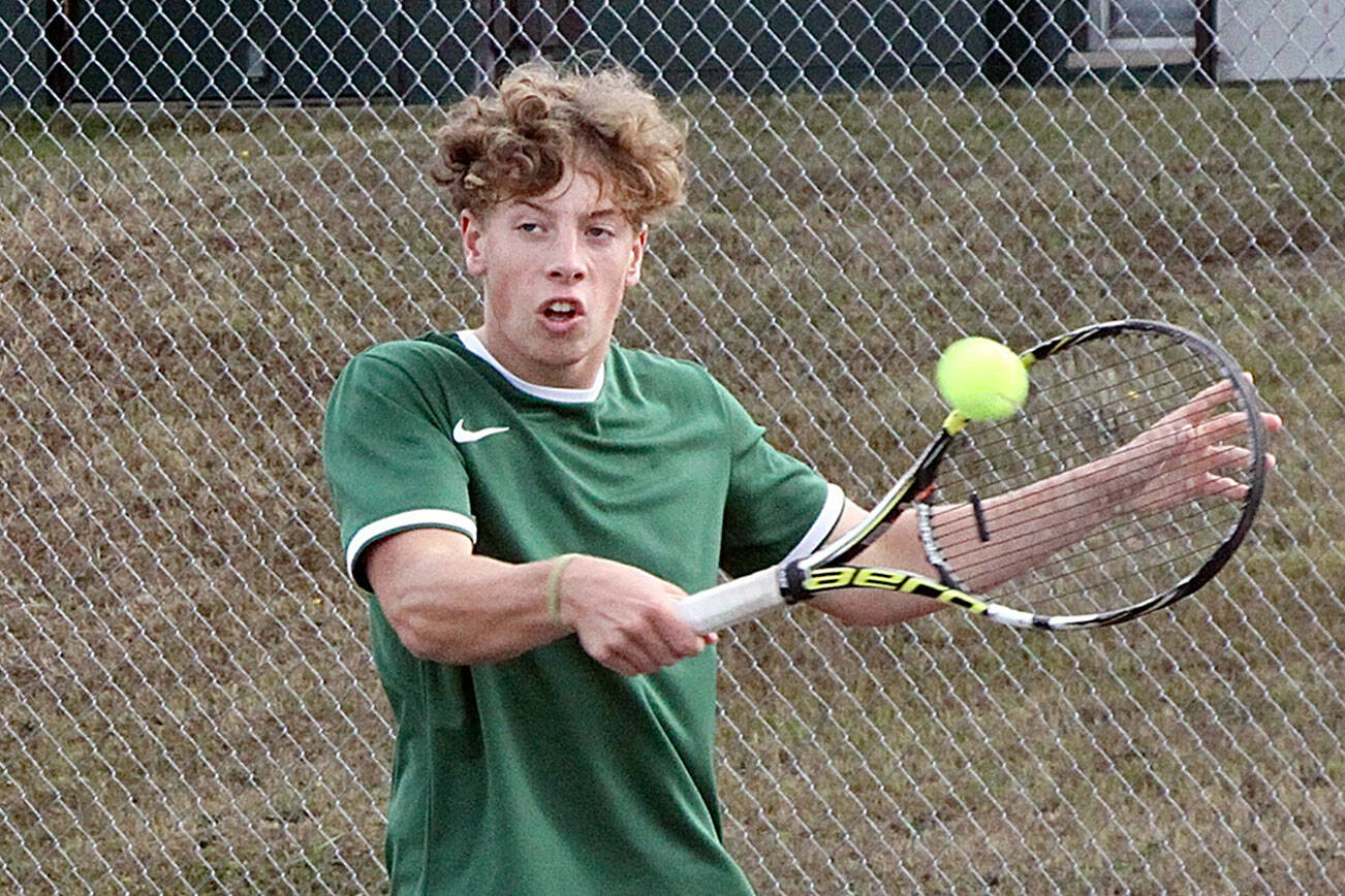 Dave Logan/for Peninsula Daily News
Port Angeles' No. 1 boys tennis singles player Reef Gelder backhands a volley in the team's match against North Kitsap on Monday.