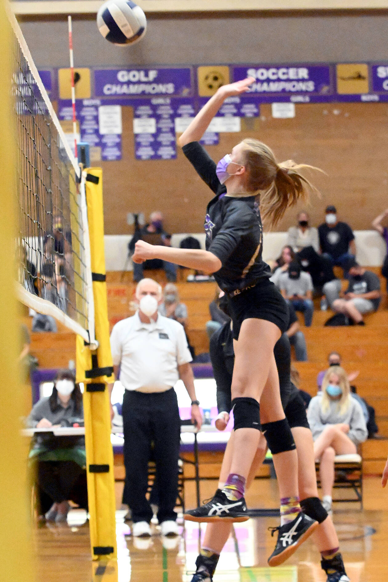 Sequim’s Jolene Vaara swings away at the net during a match with Bainbridge on Tuesday. (Michael Dashiell/Olympic Peninsula News Group)