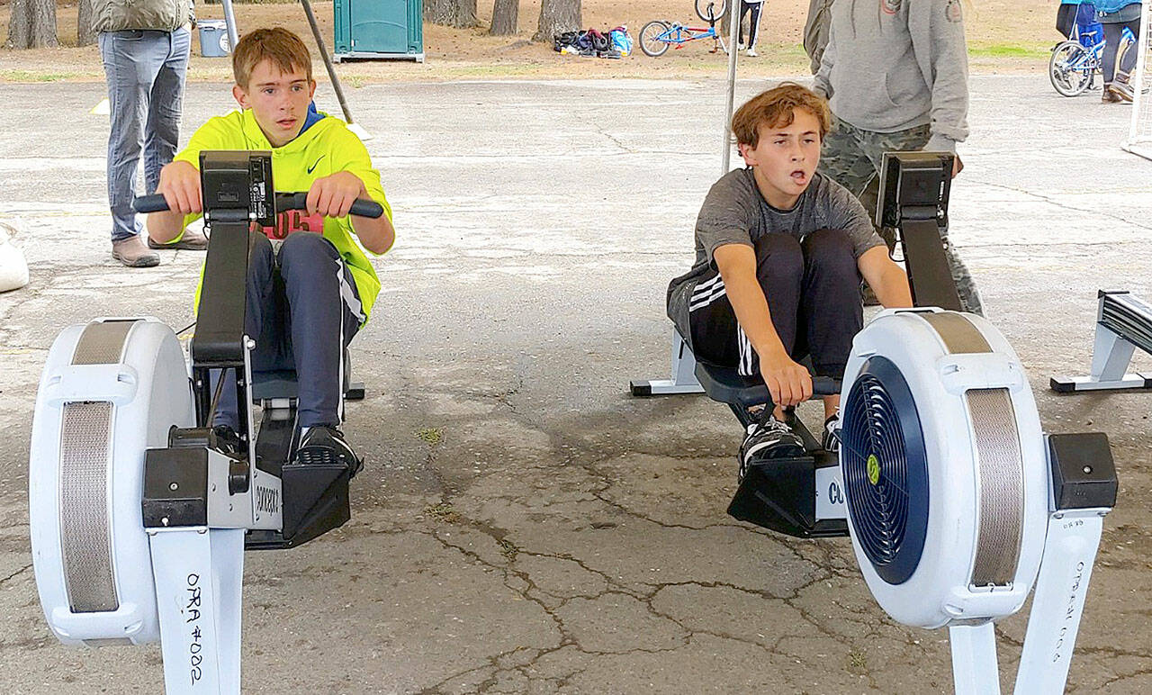 Lukas Teague of Port Angeles and Grady White of Port Townsend battle it out on the second of three events in the Little Hurt Triathlon on Sunday at Lincoln Park in Port Angeles.