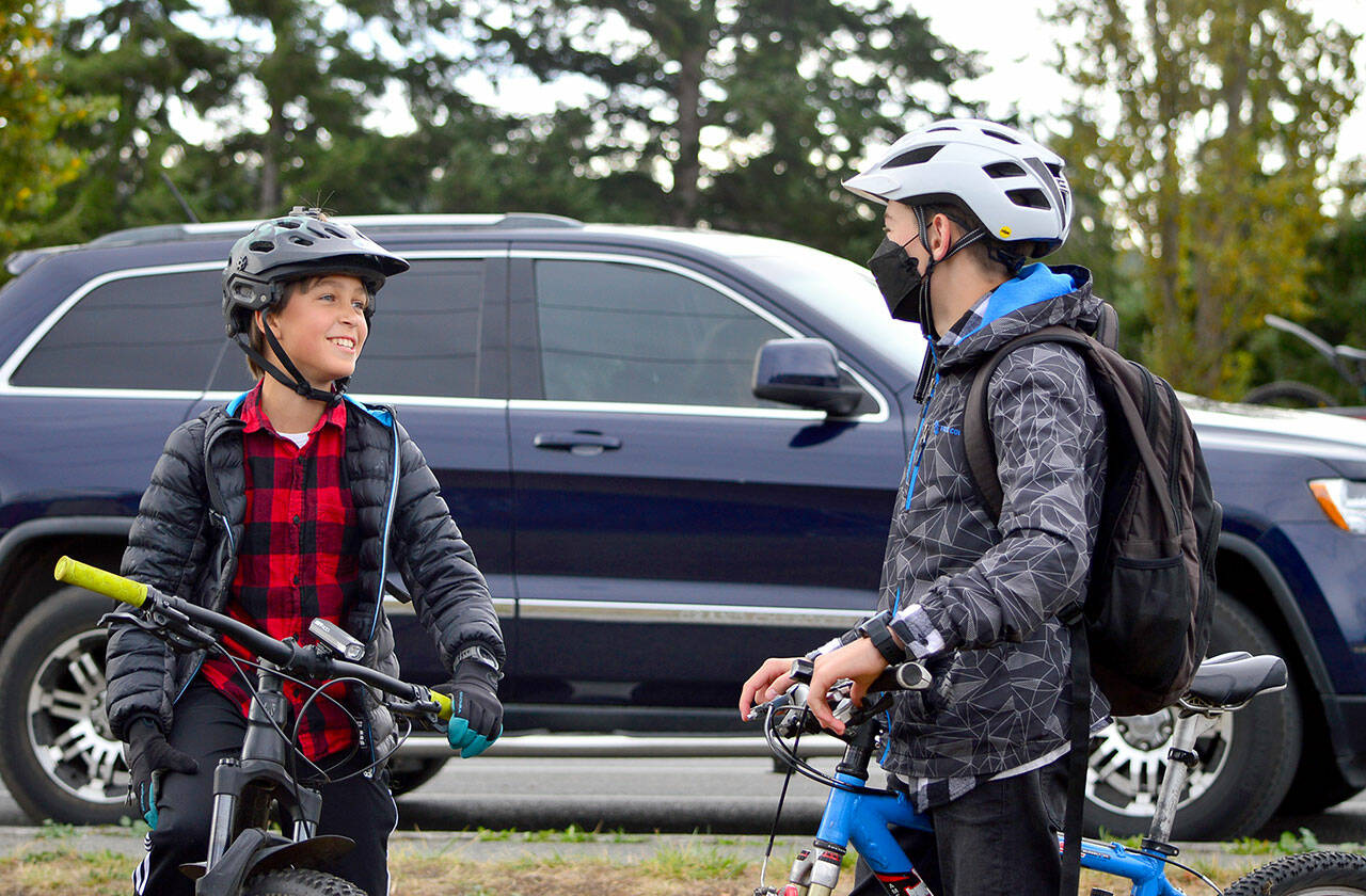 Django Lynge, 13, and Dustin Hines, 14, stand ready for Wednesday’s ReCyclery Mountain Bike Club ride around Port Townsend. (Diane Urbani de la Paz/Peninsula Daily News)