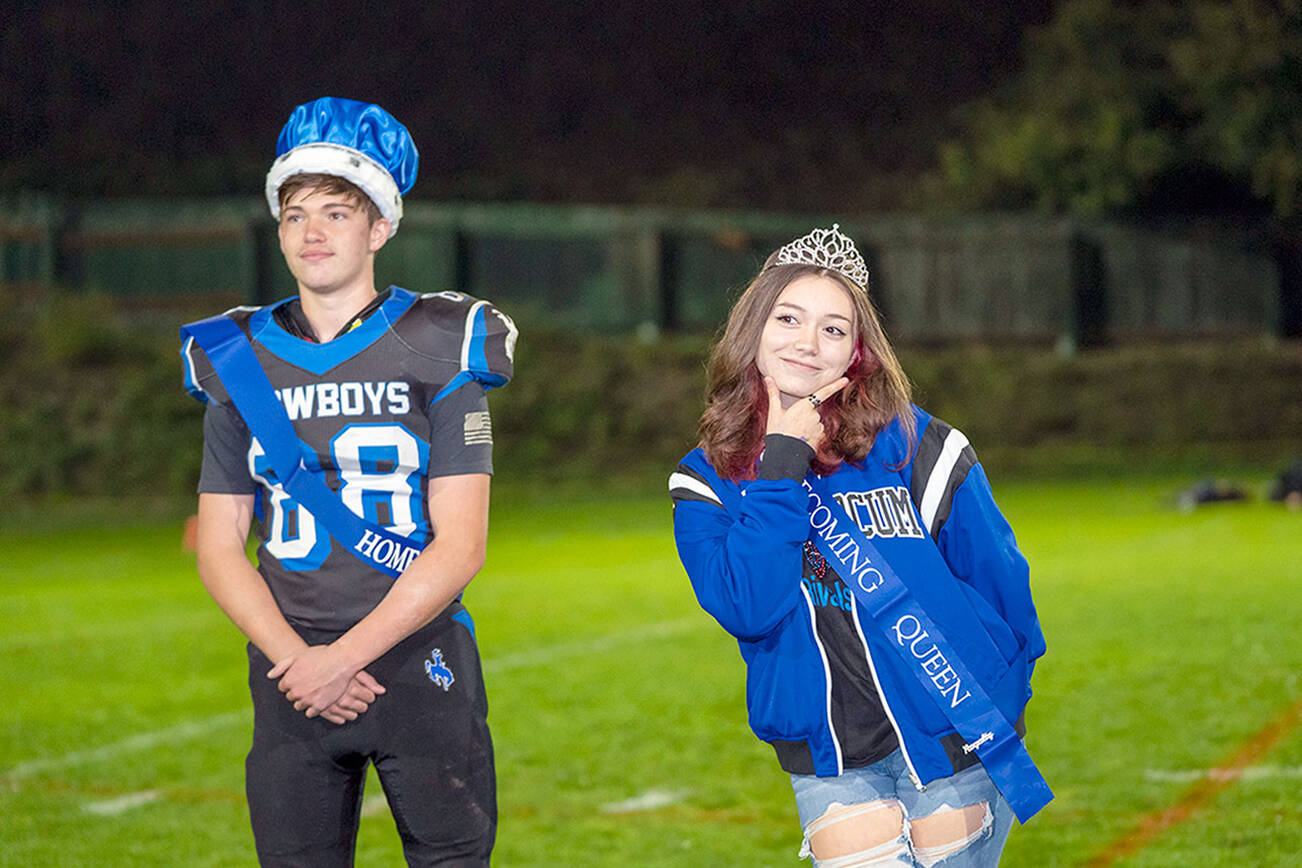 Mikiya Shiflett, left, the Chimacum High School homecoming king, and Hannah Cotterill, queen, are presented Friday during halftime of the East Jefferson football game against Cascade Christian at Memorial Field in Port Townsend. The Port Townsend king and queen, Jerome Reaux Jr. and Faye Berry, also were honored during halftime. Chimacum and Port Townsend have combined sports programs and are competing together as the East Jefferson Rivals. (Steve Mullensky/for Peninsula Daily News)