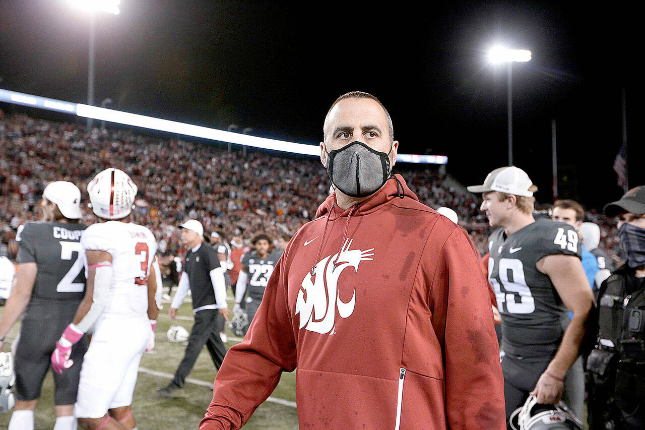 Washington State coach Nick Rolovich walks on the field after the team’s NCAA college football game against Stanford, Saturday, Oct. 16, 2021, in Pullman, Wash. Washington State won 34-31. (AP Photo/Young Kwak)