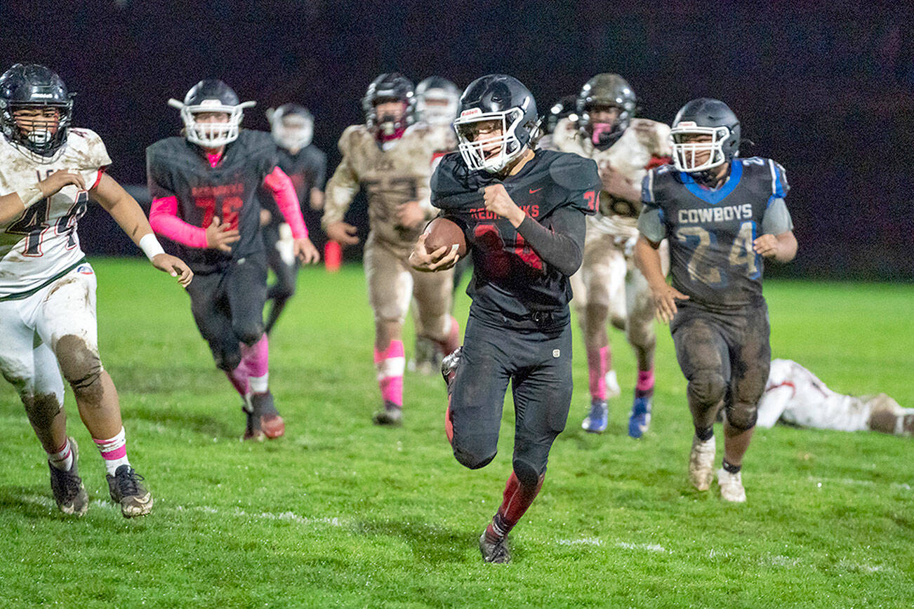 Steve Mullensky/for Peninsula Daily News

East Jefferson’s Logan Massie makes a 60 yard run for a touchdown during a game on Friday played against Life Christian Academy at Memorial Field in Port Townsend.