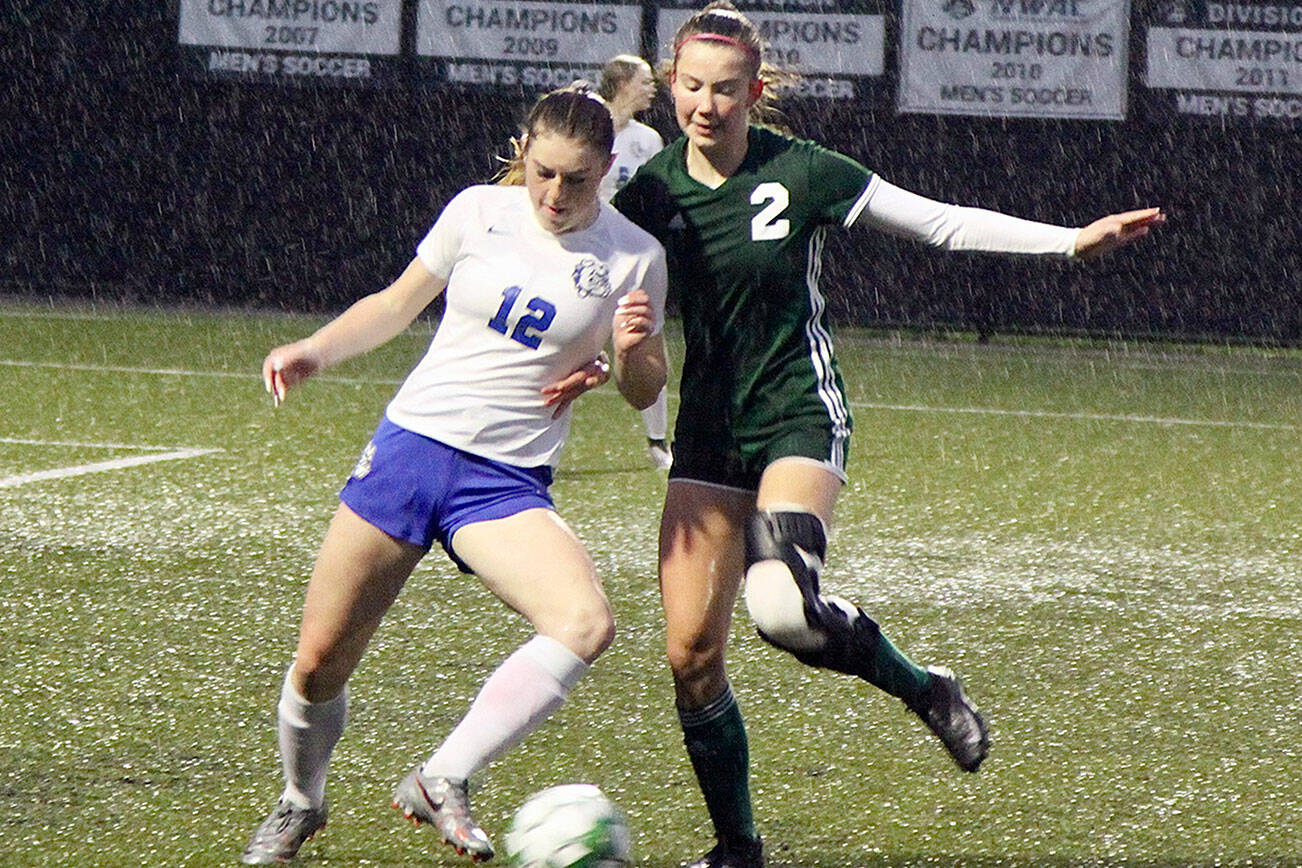 #12 Grace Smelcer of the North Mason girl Bulldogs fights with #2 Catie Brown of the PA lady Riders Monday. dlogan