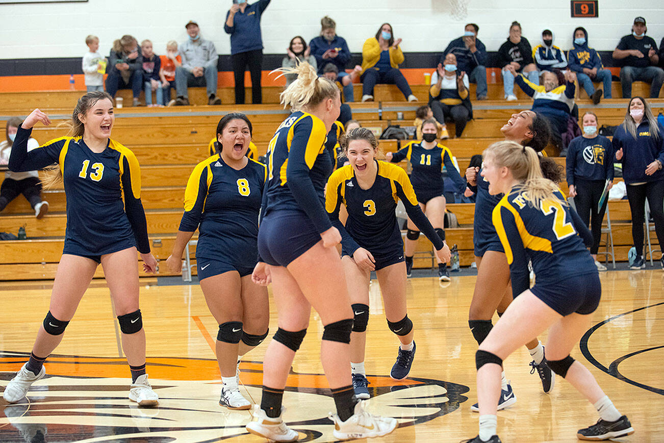 Courtesy Eric Trent/The Chronicle
Forks celebrates after downing Onalaska in a loser-out district volleyball tournament game at Napavine High School. The Spartans fell 3-2 to Rainier in a winner-to-state, loser-out contest later Wednesday evening.