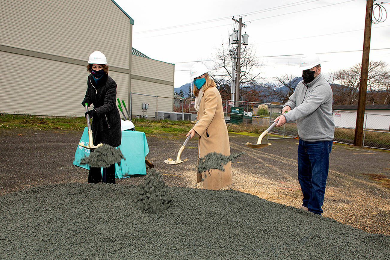 From left, Dr. Suzanne Watnick, chief medical officer of Northwest Kidney Centers; Rebecca Fox, CEO of Northwest Kidney Centers; and state Rep. Mike Chapman, D-24, break ground for the new Port Angeles Kidney Center on Chase Street.