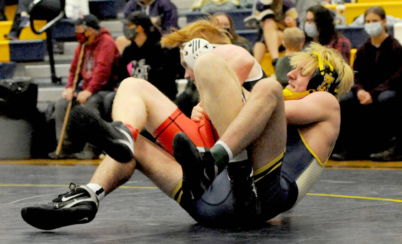 Forks’ Jake Weakley, right, pinned East Jefferson’s Gabe Evans in the 160-pound class during the Forks Wrestling Invitational held Saturday in the Spartan Gym. (Lonnie Archibald/for Peninsula Daily News)