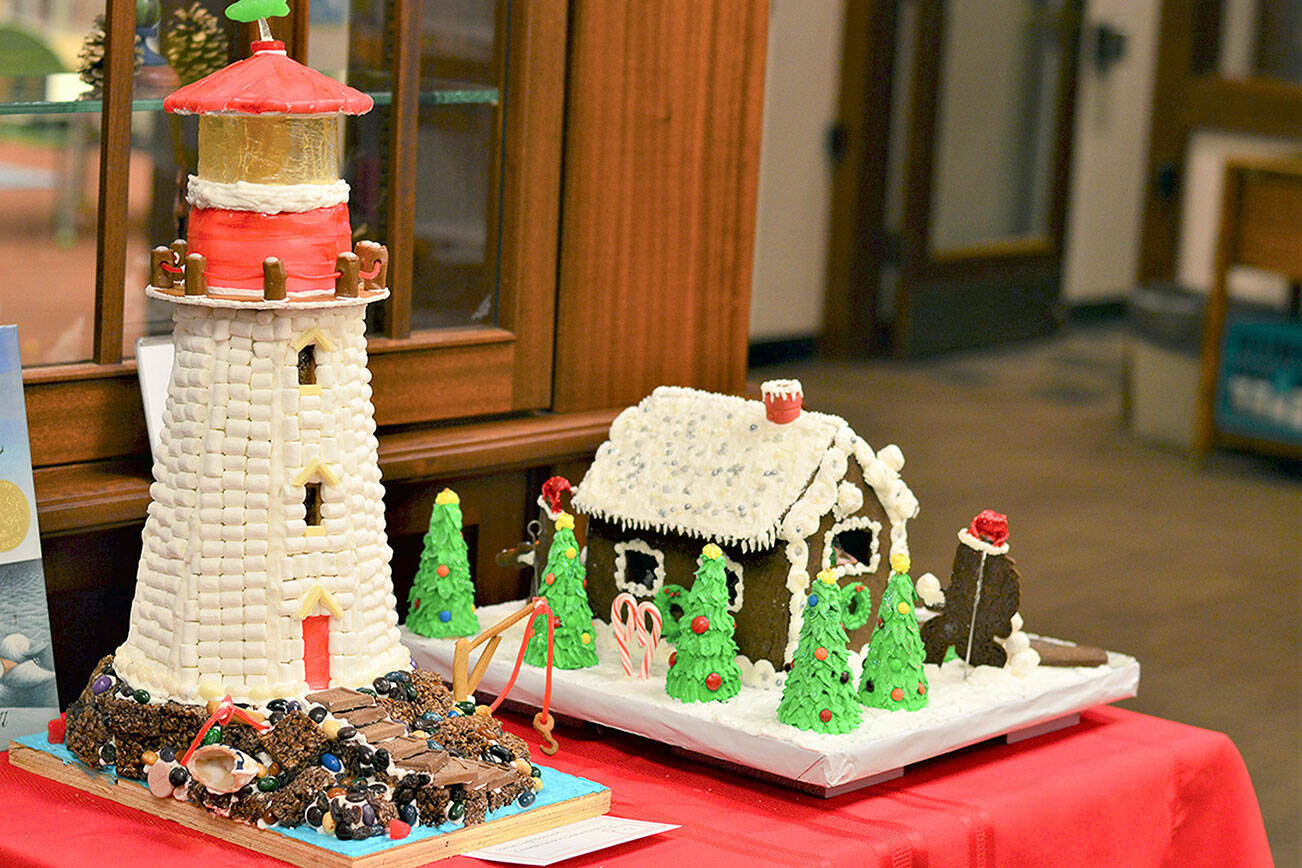 Two literary gingerbread houses, one inspired by Sophie Blackall's book "Hello Lighthouse" and one titled "The Sasquatch Who Stole Christmas," are among the 18 edible edifices on display at the Port Townsend Library, 1220 Lawrence St. For details about the Uptown Gingerbread Contest, which will accept its last entries on Tuesday, see ptpubliclibrary.org. Diane Urbani de la Paz/Peninsula Daily News