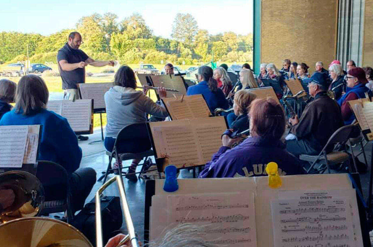 Sequim City Band members rehearse in mid-July for the first time in 16 months. The band hosts "Together Again," a free concert at the James Center for the Performing Arts, on Aug. 22. (Richard Greenway)