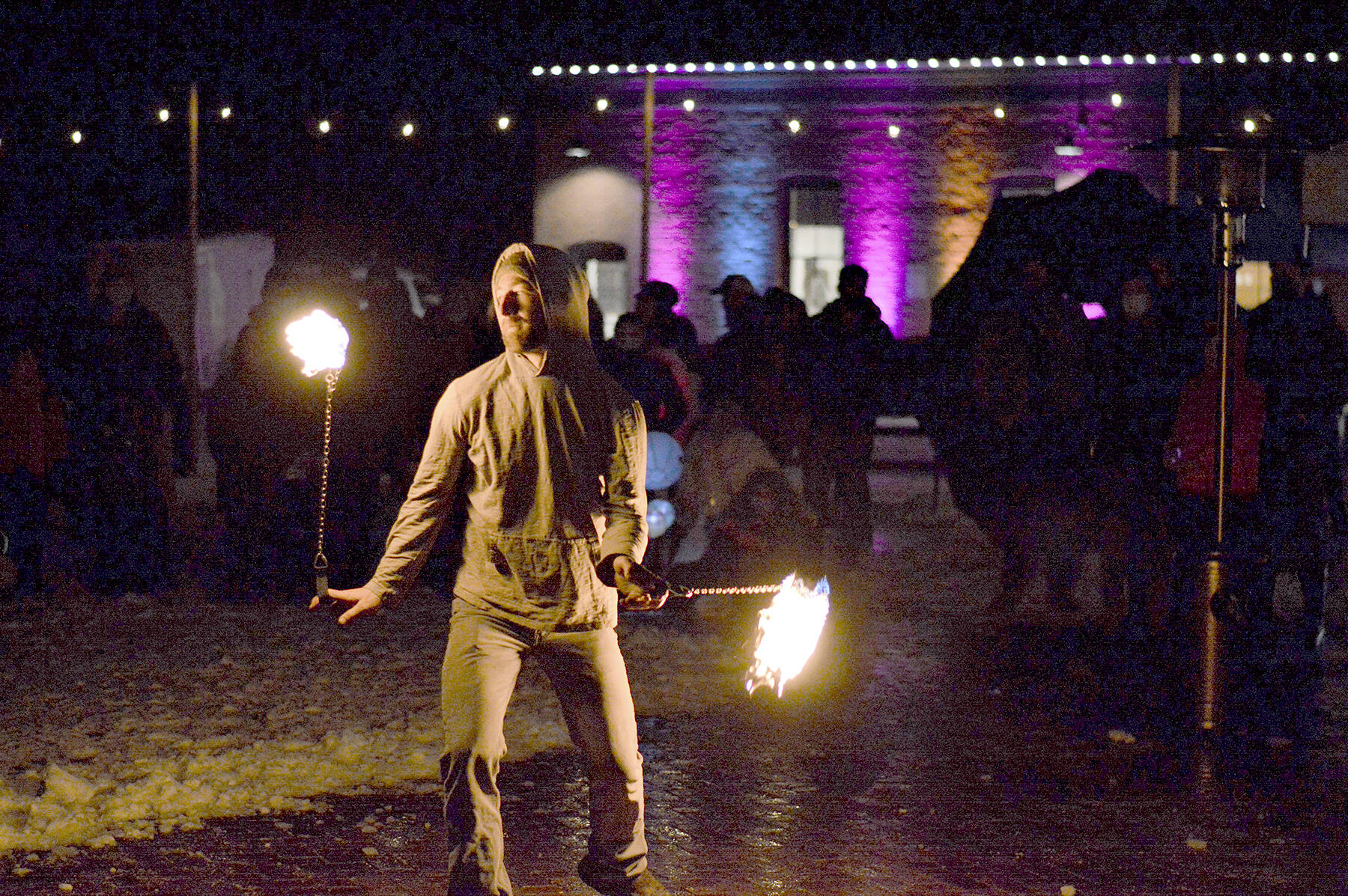 Ashley Kehl of Port Townsend did some fire dancing during the First Night festivities Friday at downtown's Pope Marine Park. He's part of an ensemble that includes Alex Eisenberg of Port Townsend and Cristy Christensen of Bellingham. Diane Urbani de la Paz/Peninsula Daily News