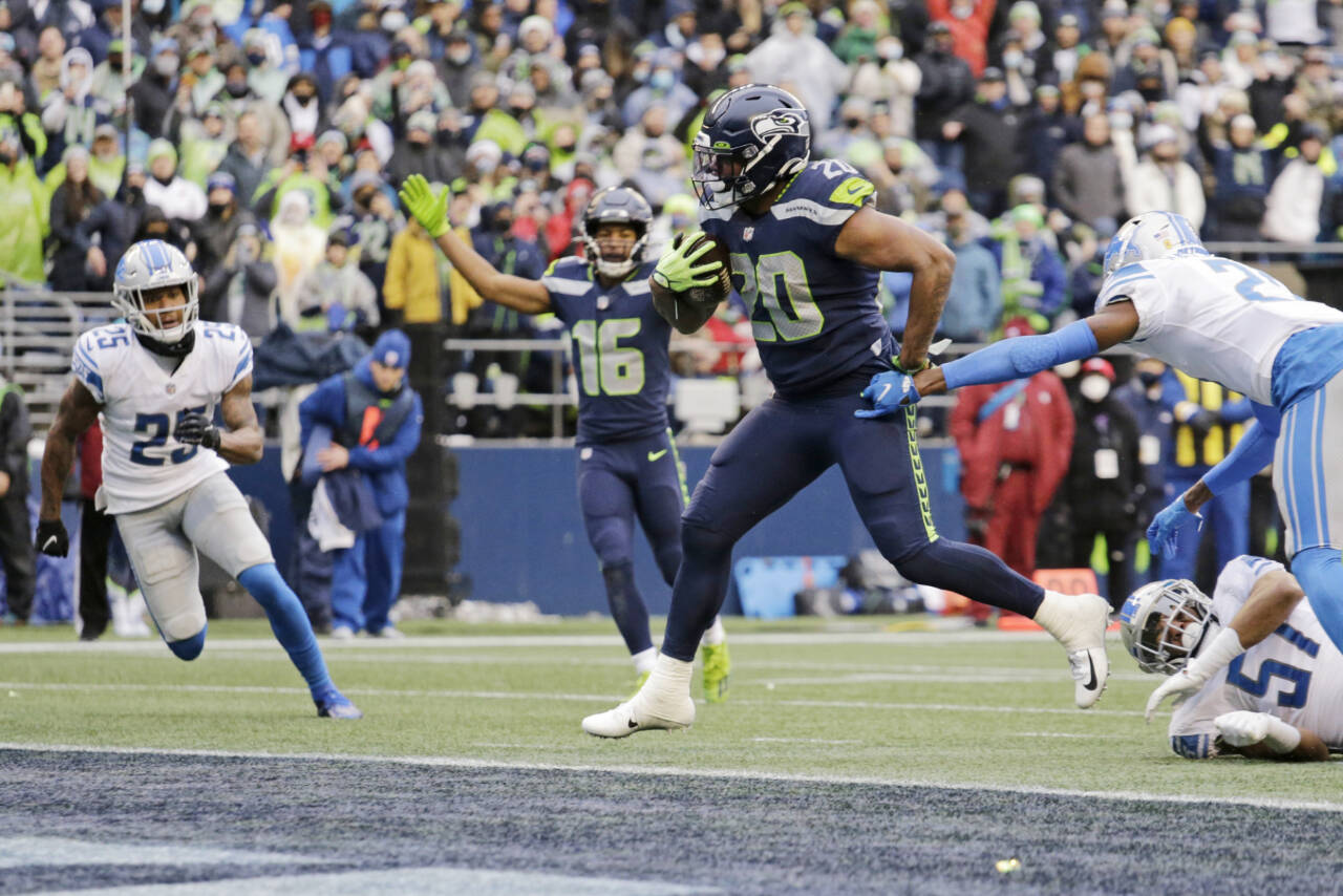 Running back Curt Warner of the Seattle Seahawks rushes for yards