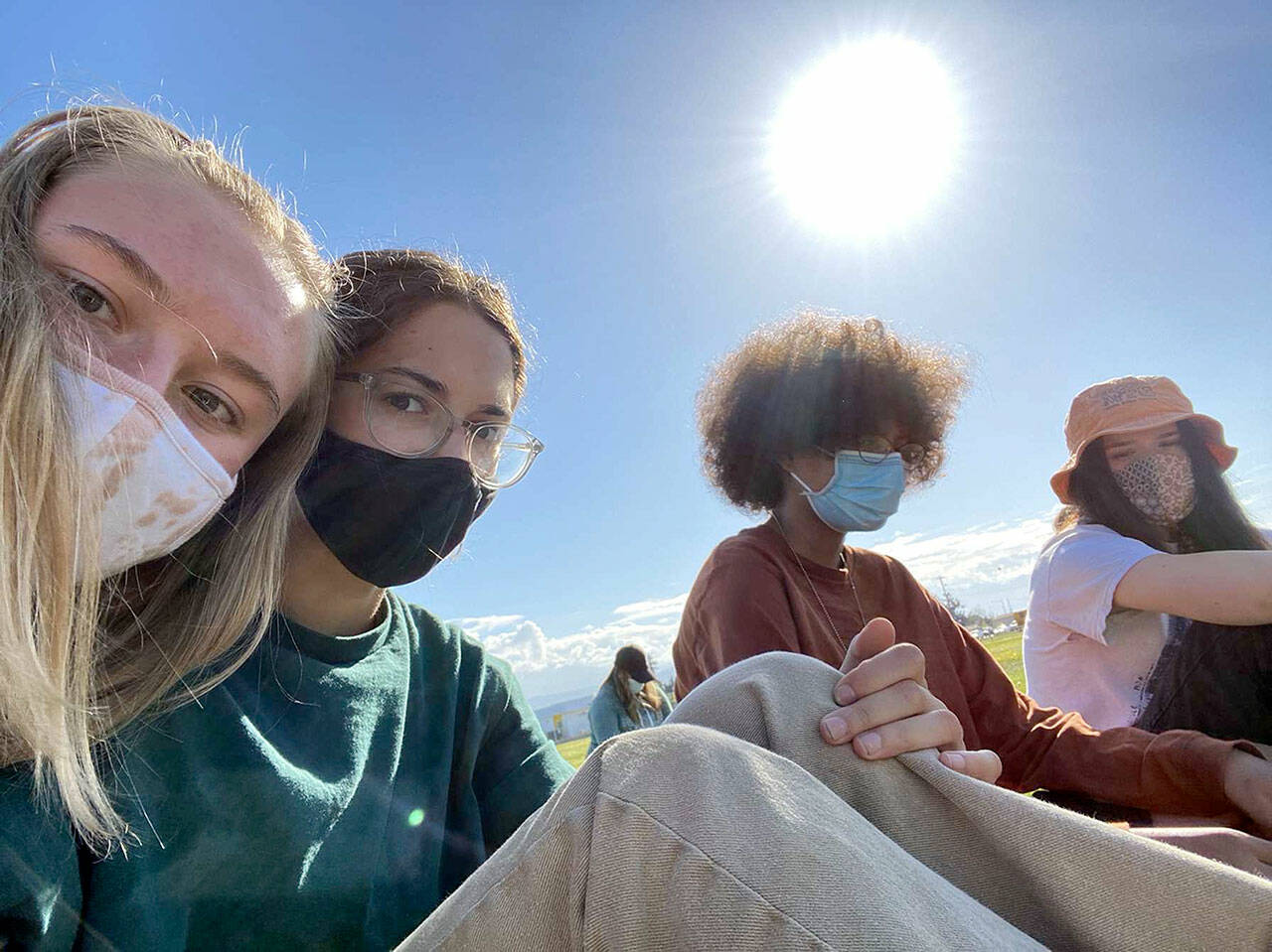 “Spring Reunion” by Celeste Tucker is one of 39 photographs in “The World on Pause,” the exhibition open now at the Port Angeles Fine Arts Center. From left are Port Angeles high schoolers Gillian Wolfe, 17, Olivia Carroll, 17, Bella Artis, 16, and Celeste Tucker, 17. (Celeste Tucker)