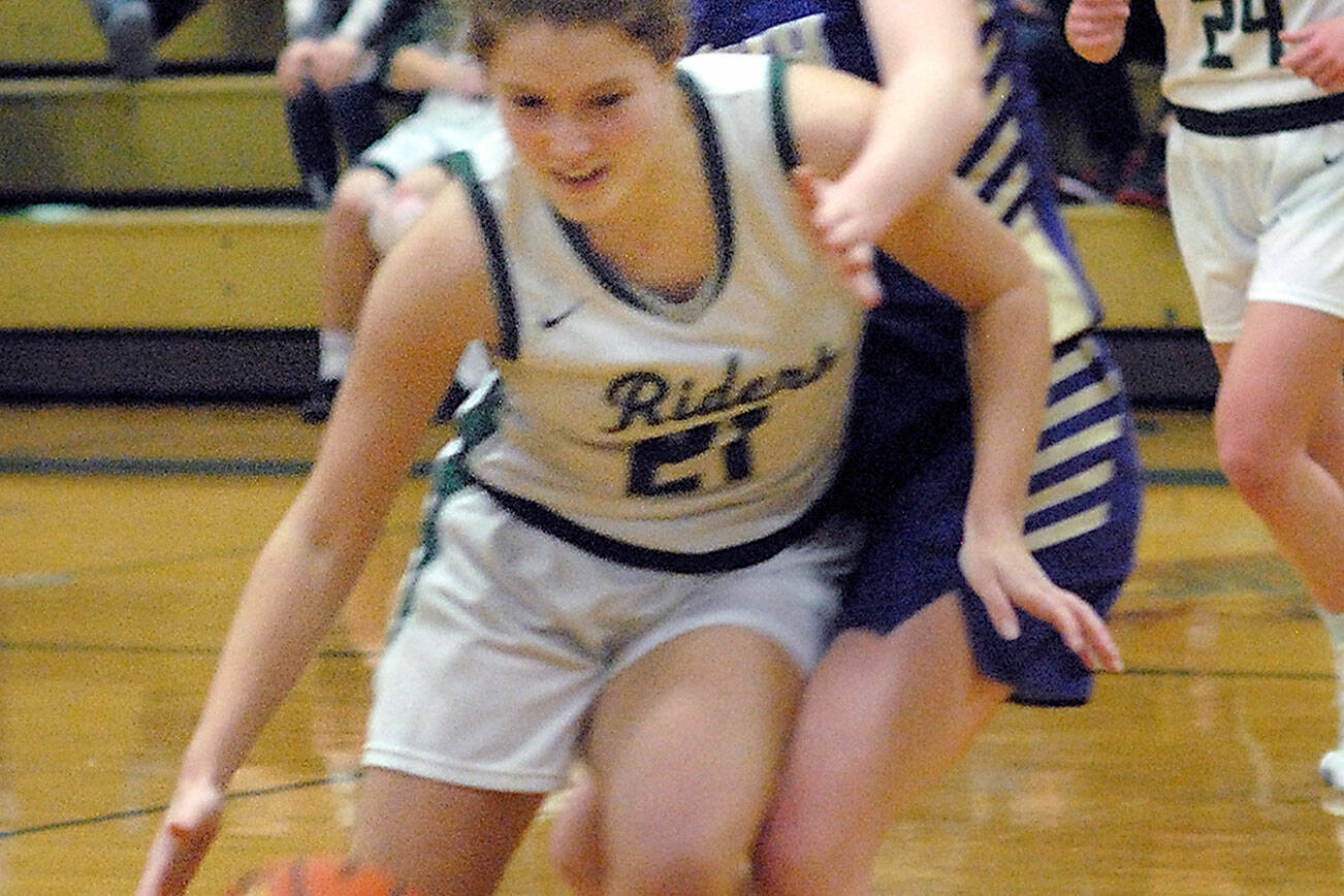 Keith Thorpe/Peninsula Daily News
Port Angeles' Jayde Gedelman, front, fends of the advances of Nort Kitsap's Sophia Baugh as Gedelman's teammate, Anna Petty, left, looks on during Thursday's game in Port Angeles.