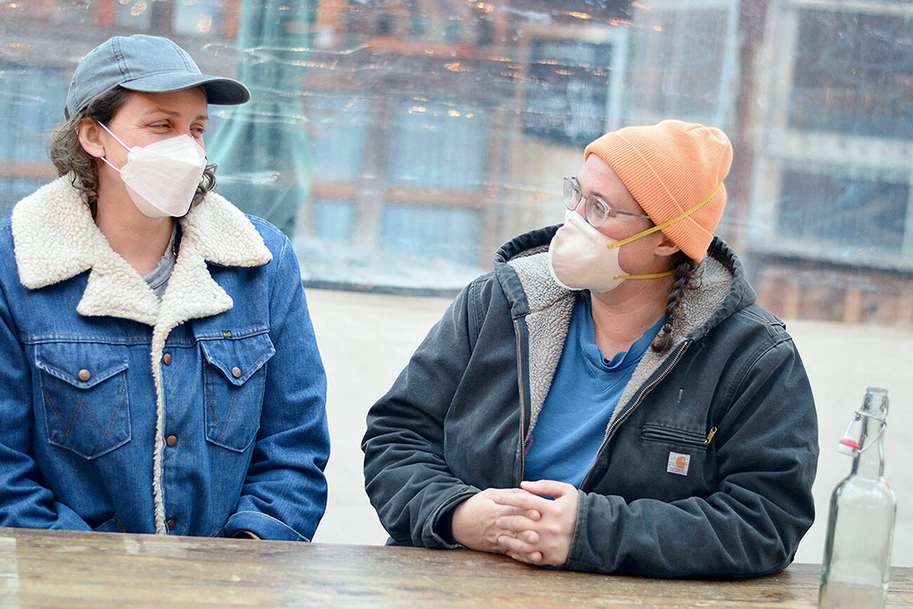 Jefferson County Anti-Racist Fund organizer Anya Callahan, left, and Goosefoot Farm grower Lex Helbling, pictured at Finnriver Farm in Chimacum, are collaborators in providing farmshares to Black, Indigenous and other people of color who live in the county. (Diane Urbani de la Paz/Peninsula Daily News)