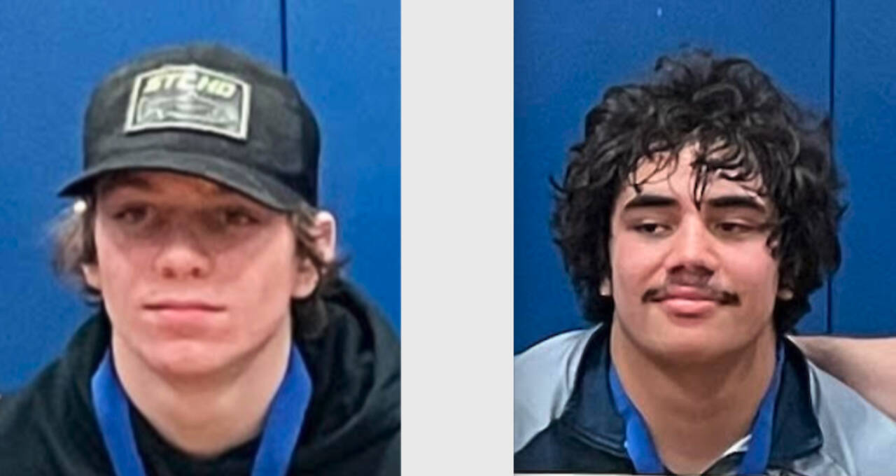 Conner Demorest, left, and Sloan Tumaua, Forks wrestlers and regional champions.