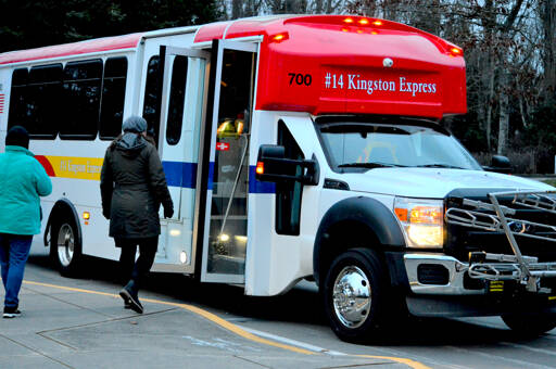 Jefferson County Commissioner Kate Dean greeted Jefferson Transit’s No. 14 Kingston Express bus Tuesday morning as it began its first trip — with eight passengers — to the Kingston ferry dock. Rides are free through March 31 on the new route, whose departures are at 7:15 a.m. and 2:45 p.m. Monday through Saturday from Port Townsend’s Haines Place transit center. The bus stops at Jefferson Transit’s Four Corners park-and-ride lot and at the Gateway Visitors Center in Port Ludlow on its 72-minute journey to Kingston, where riders can catch the Kitsap Transit foot ferry to Seattle or the Washington state ferry to Edmonds. Information can be found at https://jeffersontransit.com/14kingstonexpress. (Diane Urbani de la Paz/Peninsula Daily News)