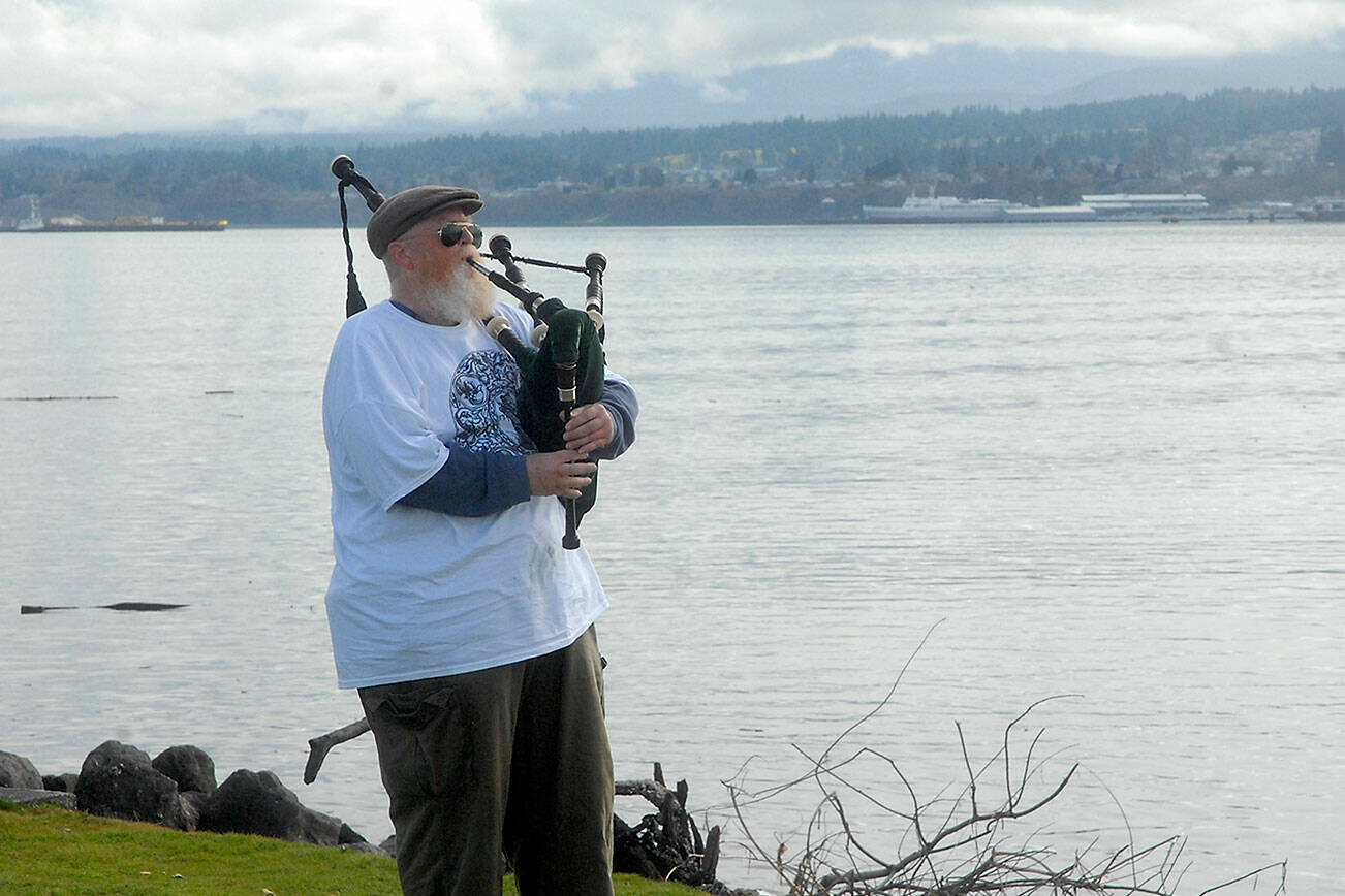 Keith Thorpe/Peninsula Daily News
Erik Evans of Port Angeles, otherwise known as the "Parking Lot Piper," gives a free bagpipe performance on Tuesday at Sail and Paddle Park on Ediz Hook in Port Angeles. Evans, who often plays with fellow piper Tomas McCurdy, has been offering weekly outdoor sets since April 2020 and currently pipes on a weather-permitting schedule of noon on Tuesdays on Ediz Hook and noon on Fridays at Sequim's Carrie Blake Park.