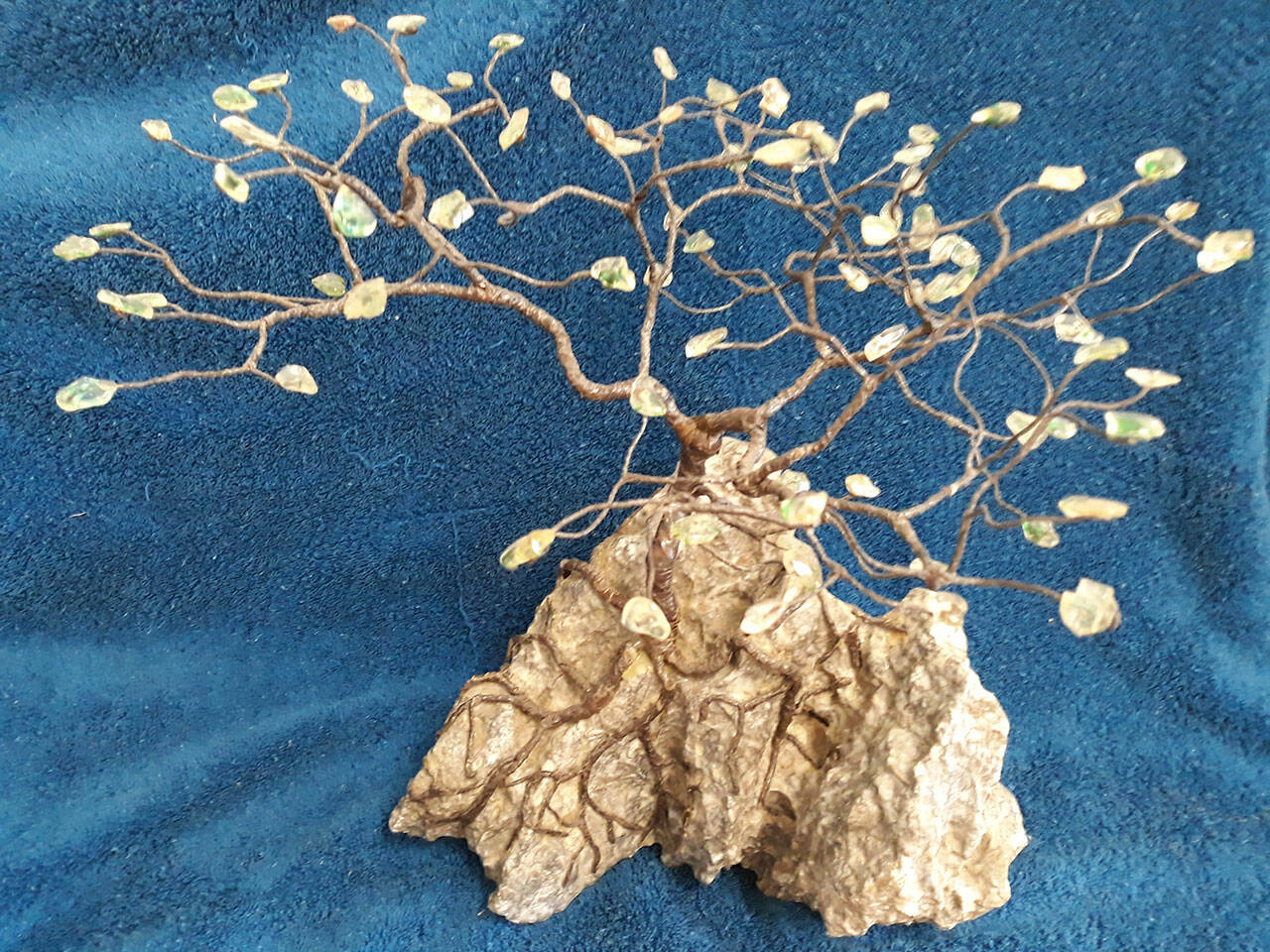 This Ming gem tree designed and made by Terry Stockman, Clallam County Gem & Mineral Association president, is one of several raffle items at the club’s annual show set for March 19-20 in Port Angeles. The gemstones are Sun Stones.