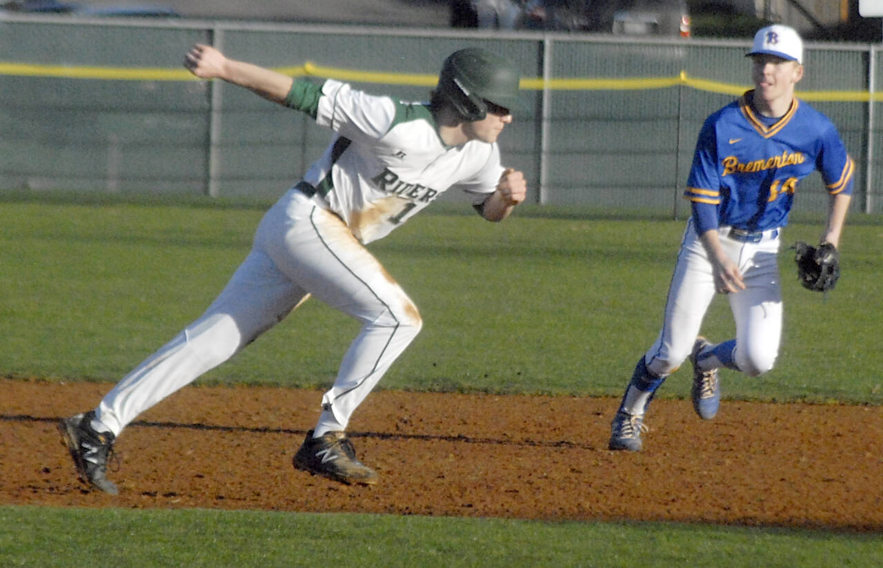 Port Angeles’ Beckett Jarnigan runs back to second base in a game at Civic Field on Tuesday. In on the play is Bremerton shortstop Landon Isenhart. (Keith Thorpe/Peninsula Daily News)