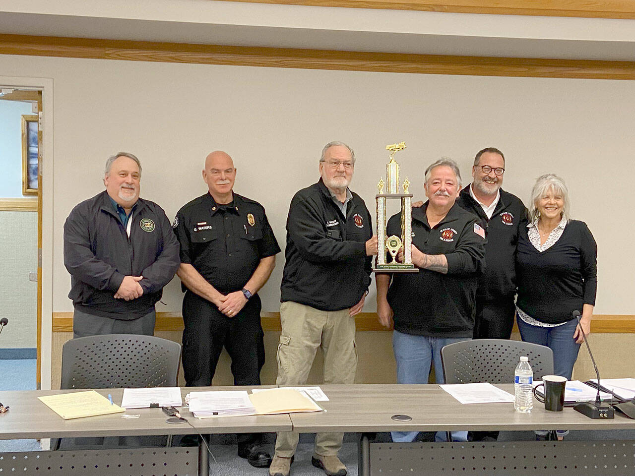 Pictured from left to right are Roger Ferris, executive director of the Washington State Fire Commissioners Association; Fire Chief Greg Waters; Commissioner Terry Barnett; Commissioner Ben Pacheco, commission chair; Commissioner Sam Nugent; and Commissioner Lynne Kastner.