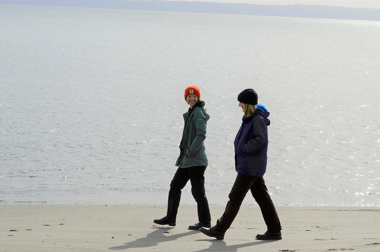 AmeriCorps service members Suzy Elbow, left, and Maggie Baker are debuting their springtime interpretive programs this Saturday at Fort Worden State Park. The pair will set up a “Wind: Nature’s Biggest Fan” exhibit near the beach in the morning and host an art-in-the-park activity beside a madrona tree in the afternoon. (Diane Urbani de la Paz/Peninsula Daily News)