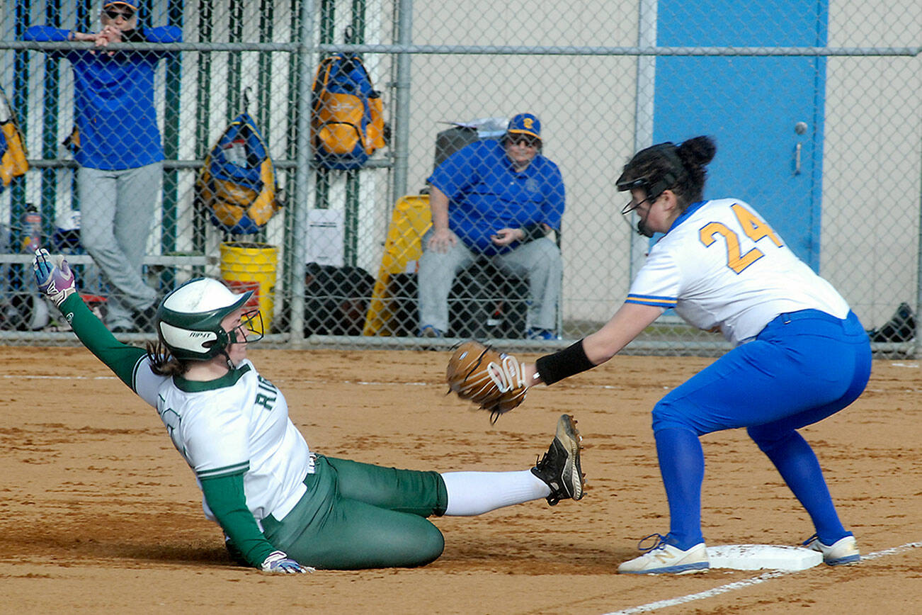 Keith Thorpe/Peninsula Daily News
Port Angeles' Abby Kimball slides into third ahead of the throw to Bremerton's Madison Gardner on Tuesday at Dry Creek School in Port Angeles.