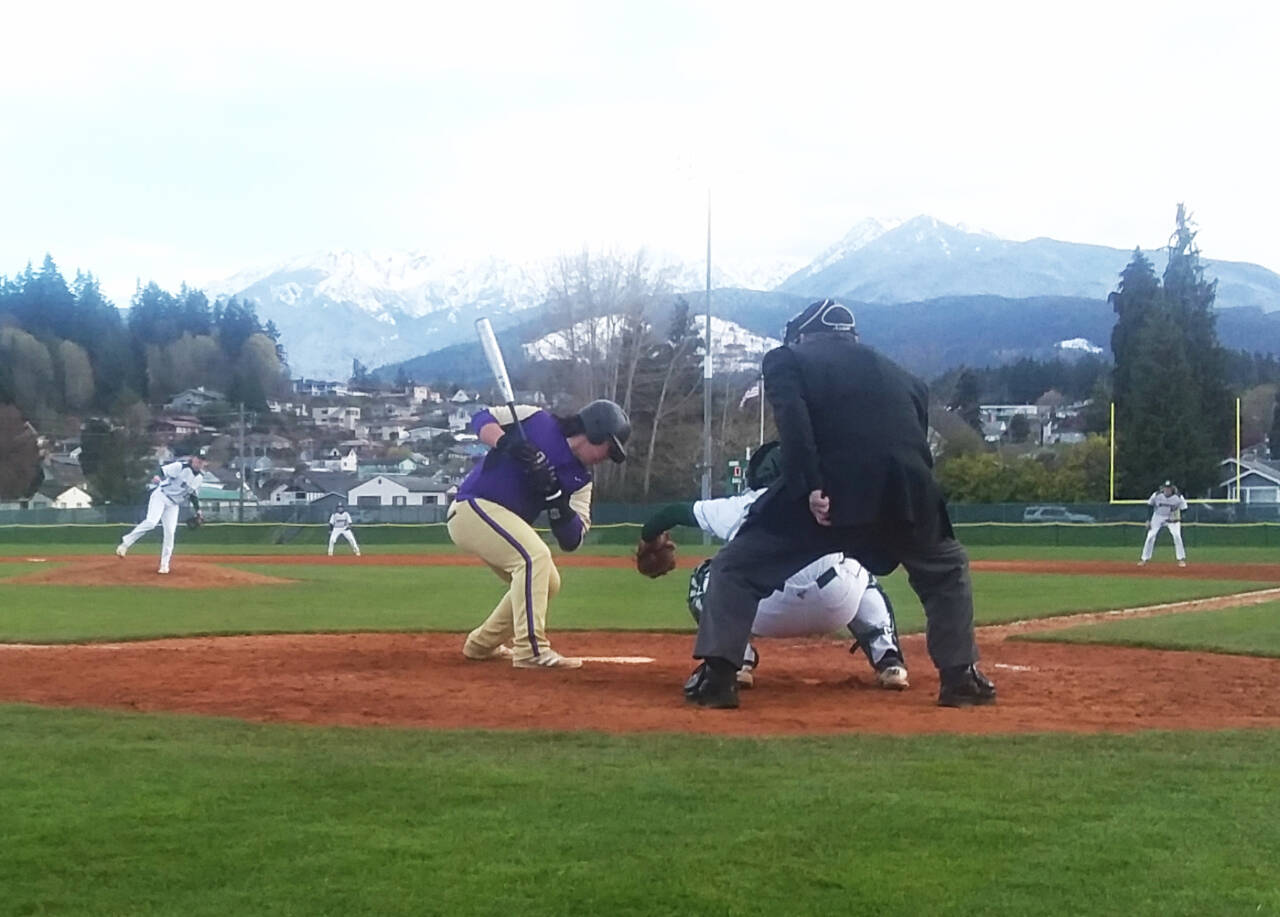 Port Angeles pitcher Elijah Flodstrom delivers a pitch to Sequim leadoff hitter Ayden Holland as Joseph Ritchie catches Monday night. Flodstrom pitched a complete-game shutout in a 10-0 win. (Pierre LaBossiere/Peninsula Daily News)