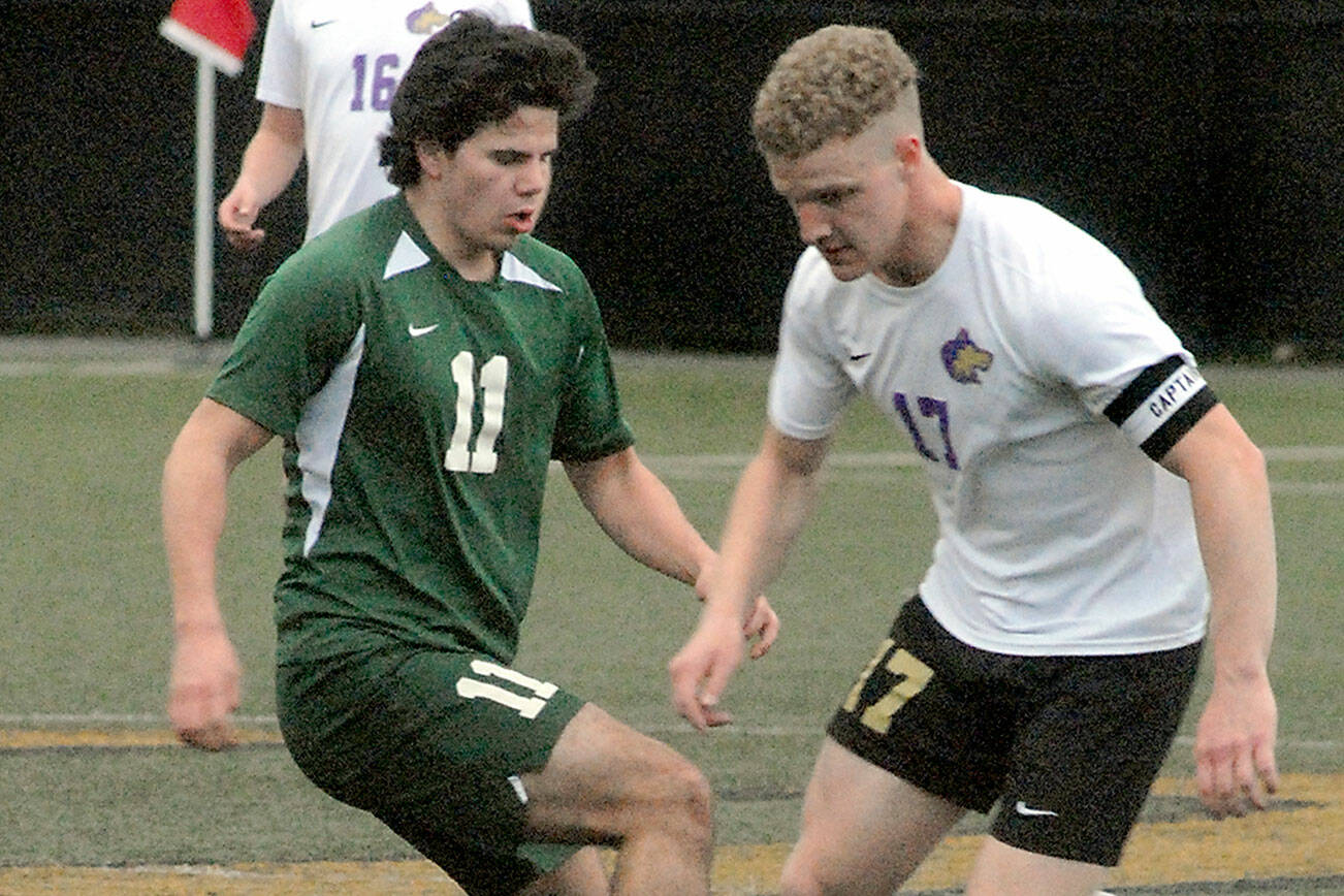 Keith Thorpe/Peninsula Daily News
Port Angeles' Xander Maestas, left, and Sequim's Aidan Henninger face off for ball control as Sequim's Harrison Bell looks on during Tuesday's match at Peninsula College in Port Angeles.