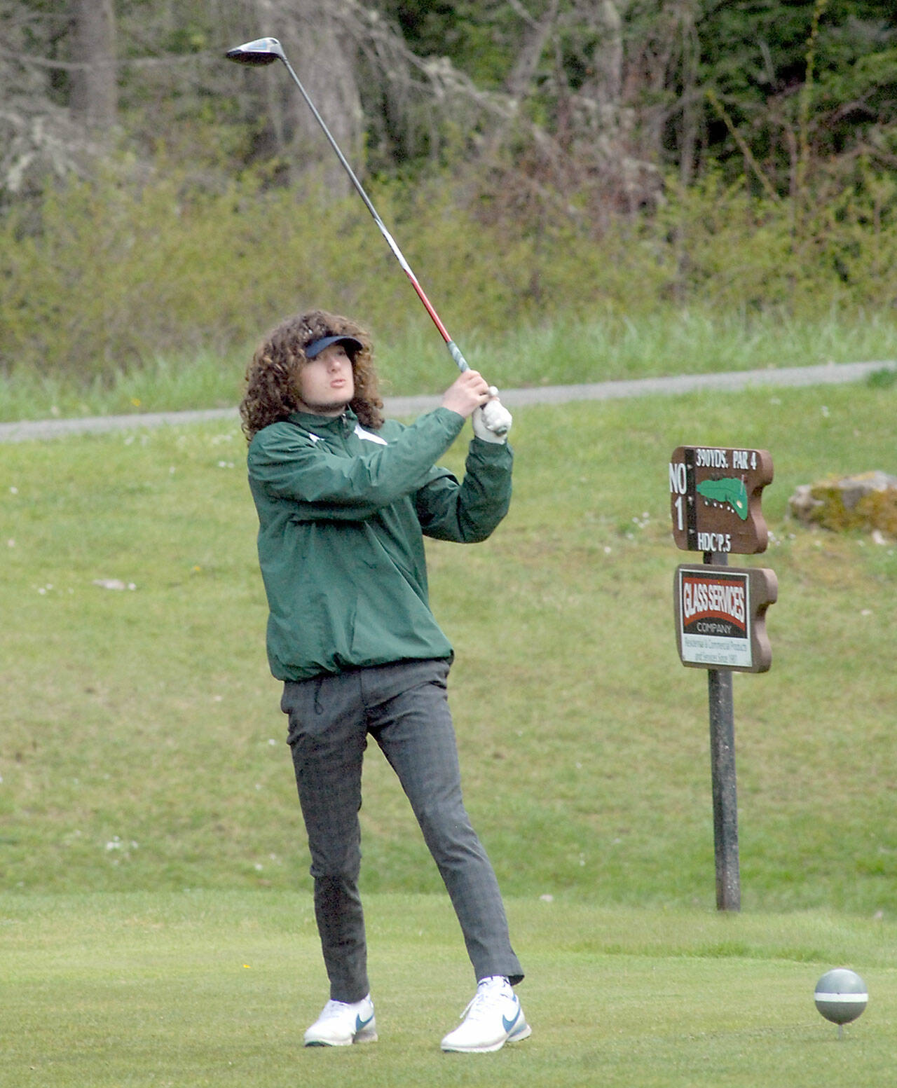 Edun Bailey of Port Angeles tees off on the first hole against Sequim on Friday at Peninsula Golf Club in Port Angeles. (Keith Thorpe/Peninsula Daily News)