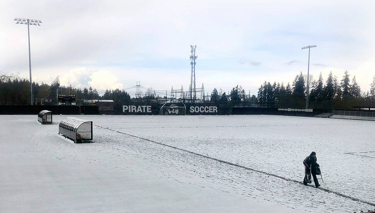 Keith Thorpe/Peninsula Daily News
A thick layer of slush coats the soccer pitch at Wally Sigmar Field at Peninsula College in Port Angeles on Saturday, forcing the cancellation of JV and varsity soccer matches between Port Angeles and Bremerton. A storm that brought winter-like conditions, along with lightning and thunder, rendered the field unplayable, prompting a postponement of the games until a later date.