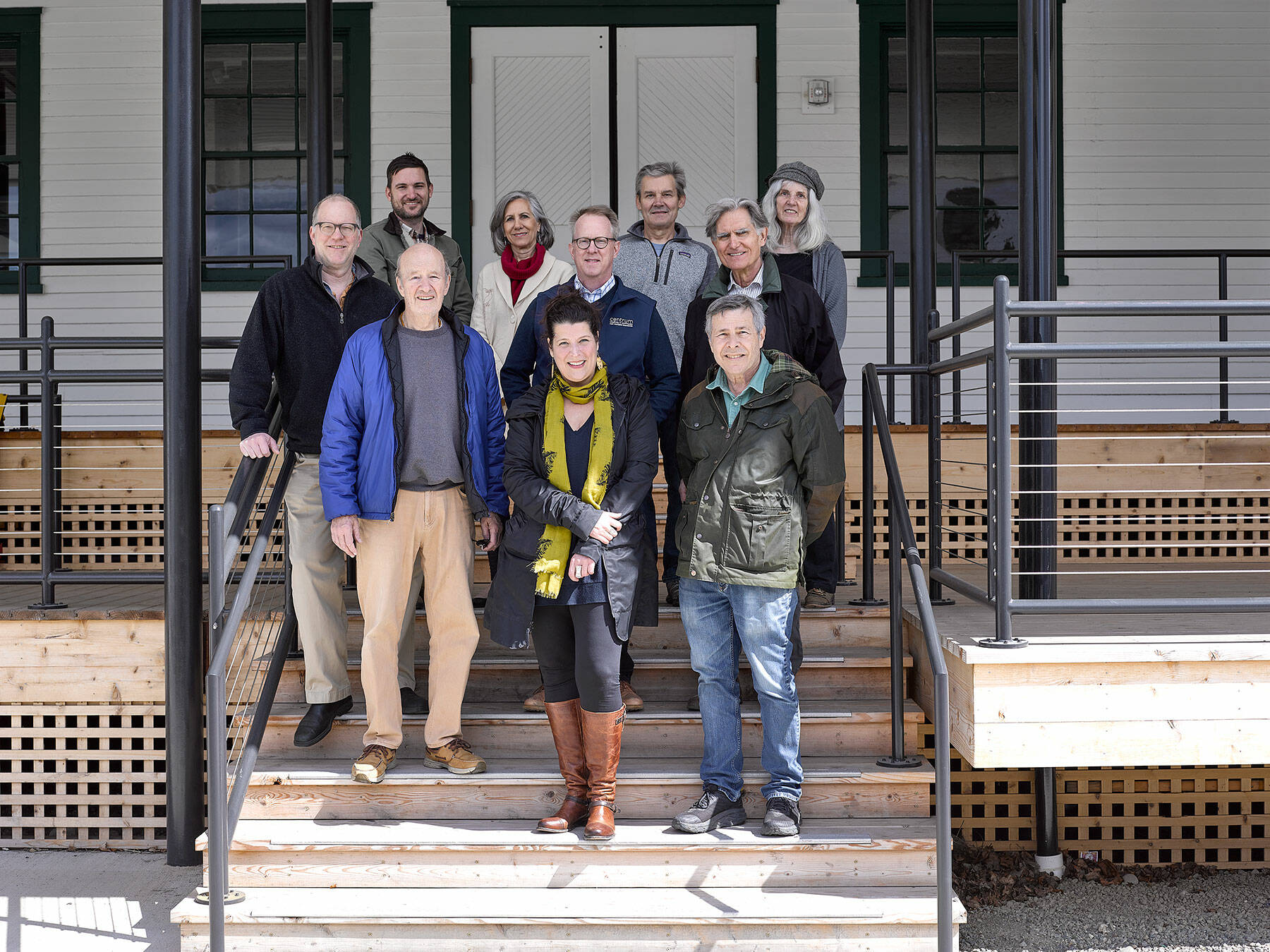 The new Creative Alliance at Fort Worden State Park includes, clockwise from left, Copper Canyon Press’ Joseph Bednarik; Heron Scott of the Port Townsend School of Woodworking; Renee Klein of Madrona MindBody Institute; Centrum’s Rob Birman; KPTZ’s Robert Ambrose, Copper Canyon’s George Knotek; KPTZ’s Kate Ingram; Corvidae Press’ Randy Arnest; Northwind Art’s Teresa Verraes and Fort Worden Public Development Authority Executive Director David Timmons. (Brian Goodman)