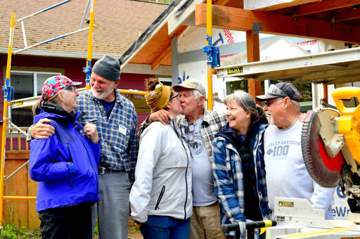 At a Habitat for Humanity job site in Port Townsend, the volunteer Care-a-Vanners — from left, Judith Noiseux and Hans Klaudt from Tucson, Ariz.; Meghan and Tom Marten of Ruidoso, N.M., and Janet and Dave Bachtel of Roseville, Calif. — take a break from construction work on Friday. (Diane Urbani de la Paz/Peninsula Daily News)