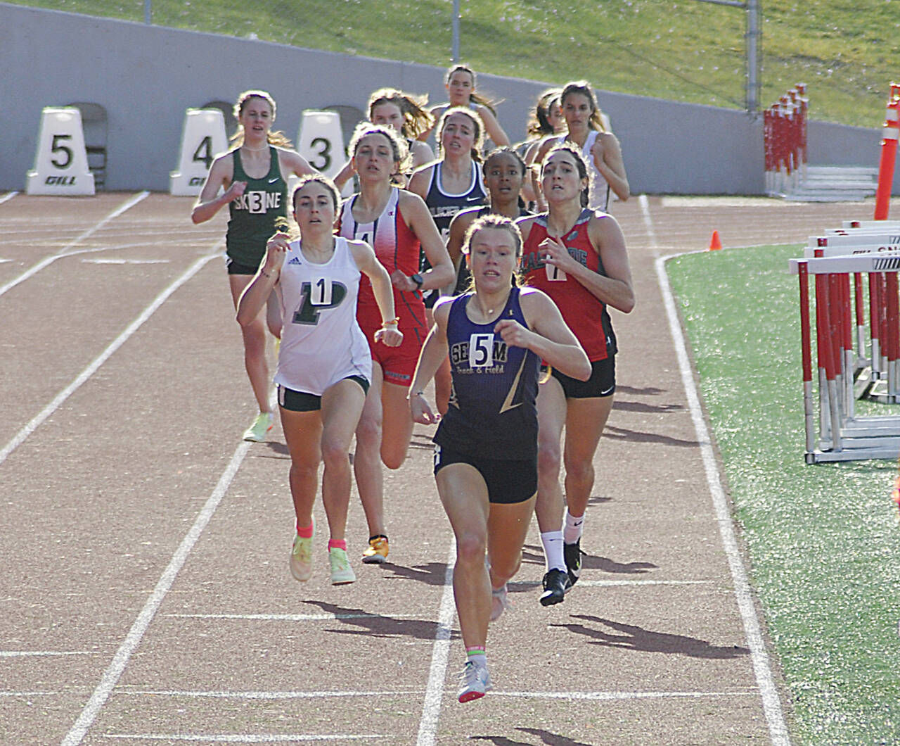 Sequim’s Riley Pyeatt leads the field in the 800 meters at the Gear Up Eason Invitational held in Snohomish on April 23. (Photo by Joanne Carroll-Huemoeller)