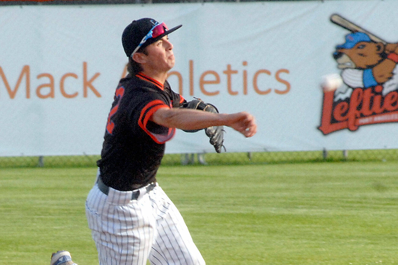 Keith Thorpe/Peninsula Daily News
Lefties shortstop Nick Oakley makes a throw to first on Thuirsday night in Port Angeles. July 22, 2021